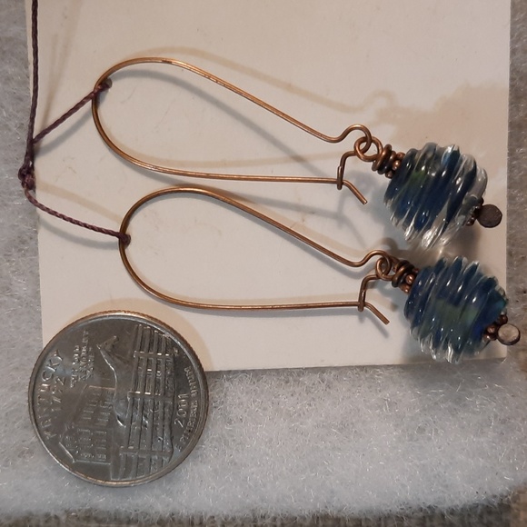 Blue and clear lamp work bead and copper dangles pierced earrings - Picture 2 of 5